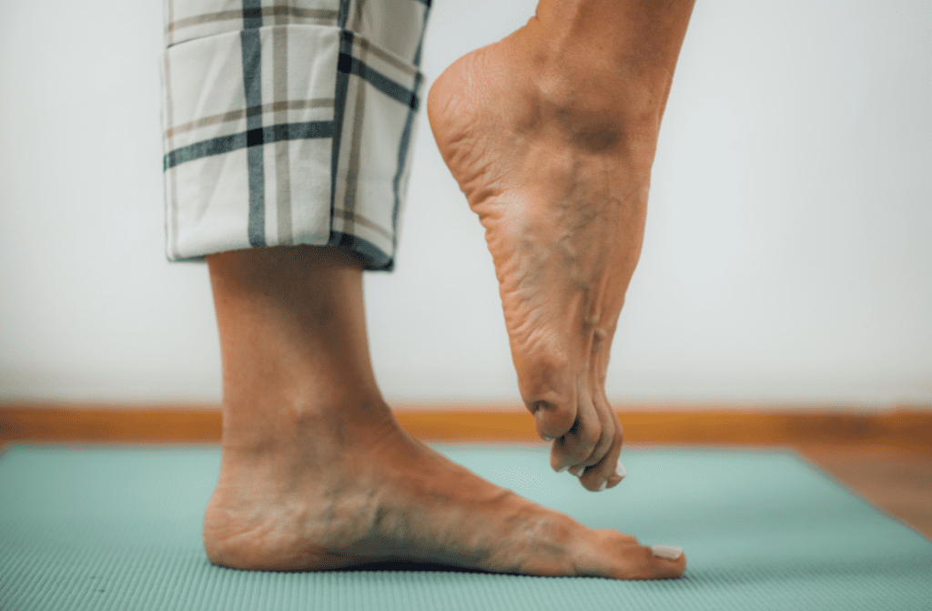 A man standing on one leg.