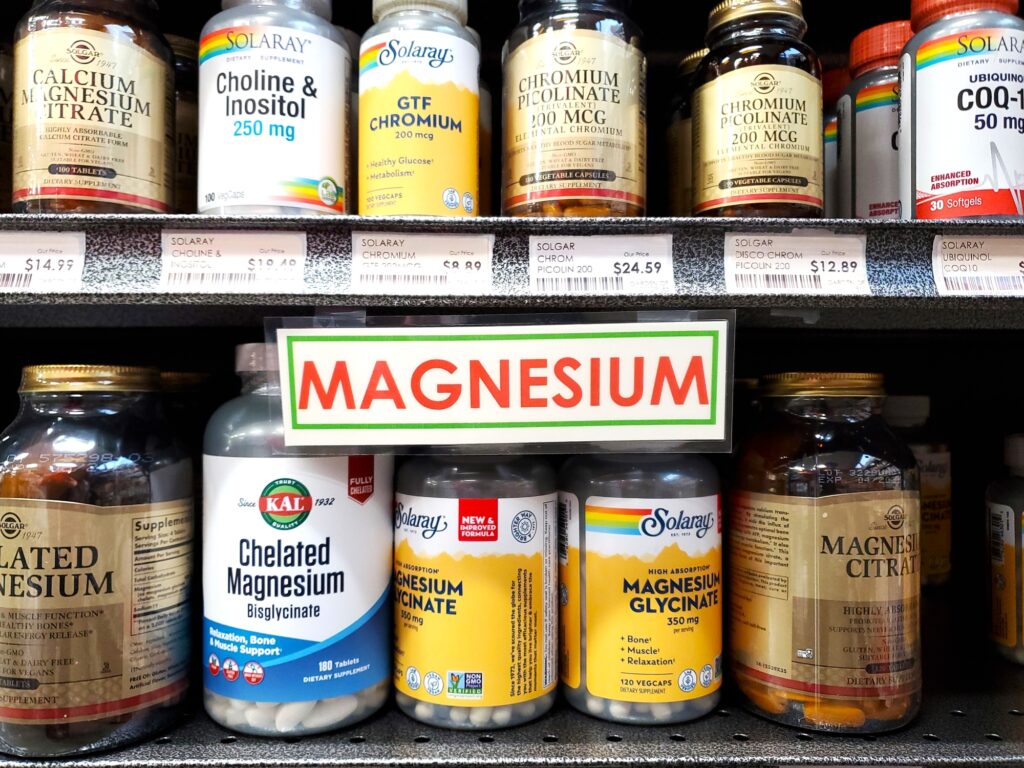 Bottles of magnesium supplements in a store.