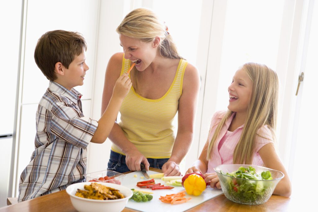 A family pre-preparing healthy fruits and vegetables
