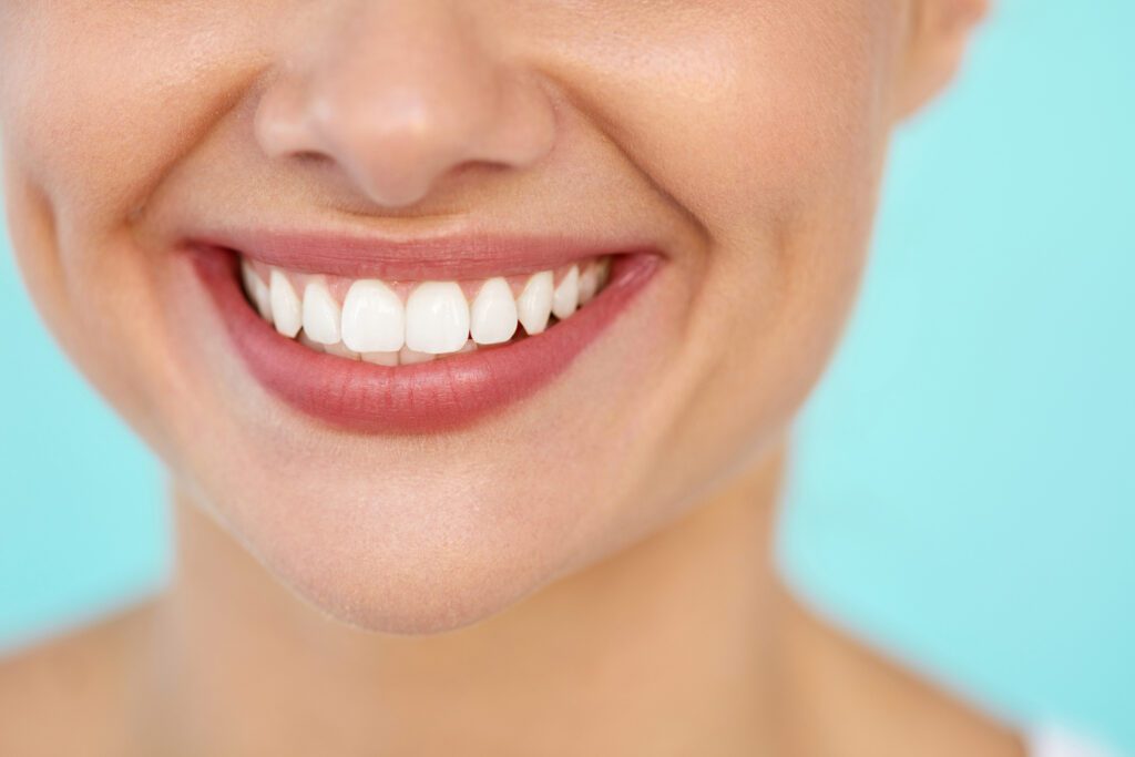 A woman smiling with healthy teeth