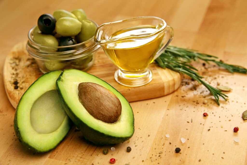 Olives, avocados, and health oil sitting next to each other
