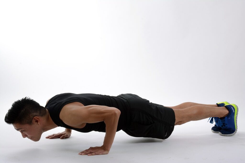 A man performing a push up exercise.