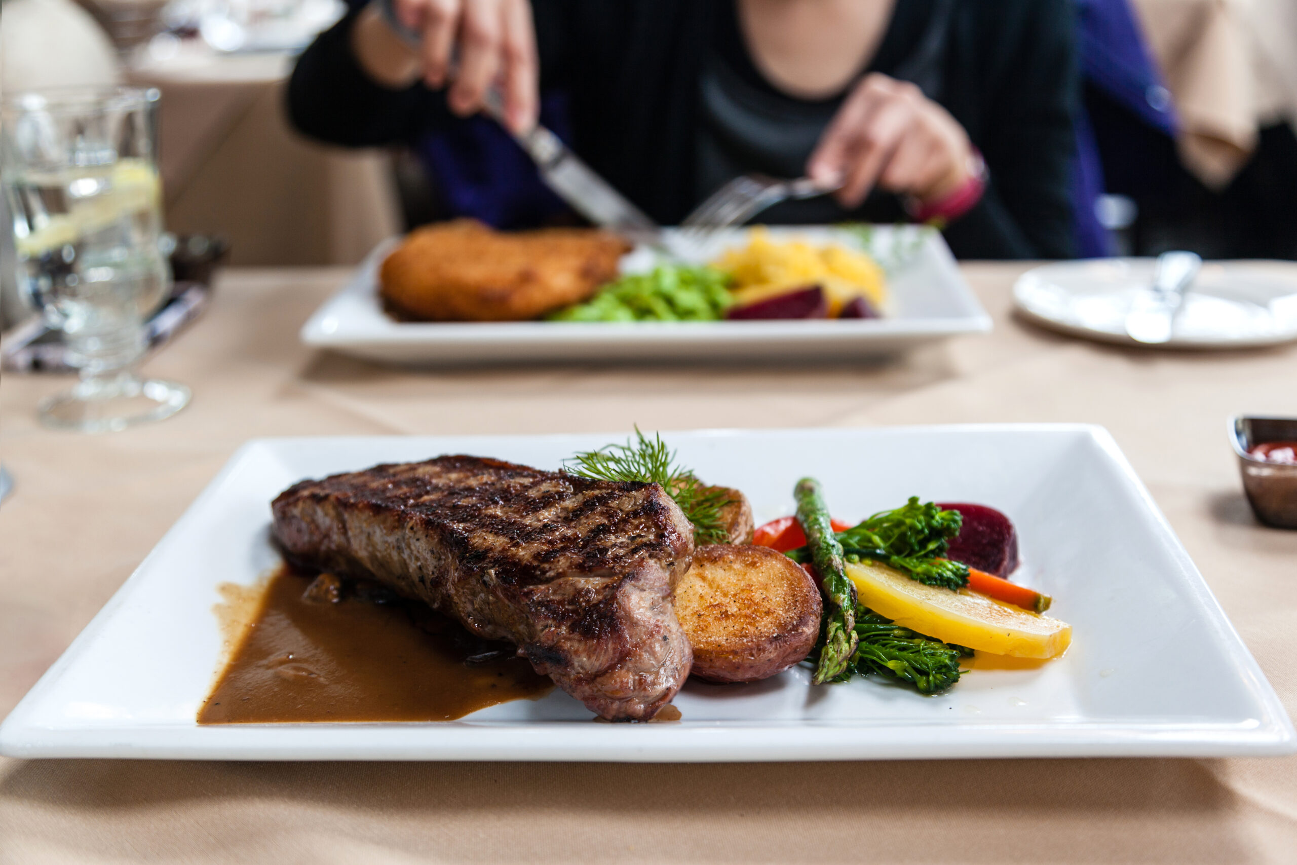 A point of view image of a person looking at their plate of food to represent mindful eating.