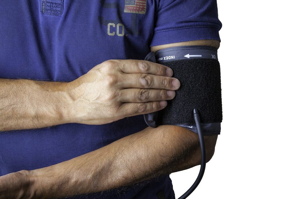 A man taking his blood pressure.