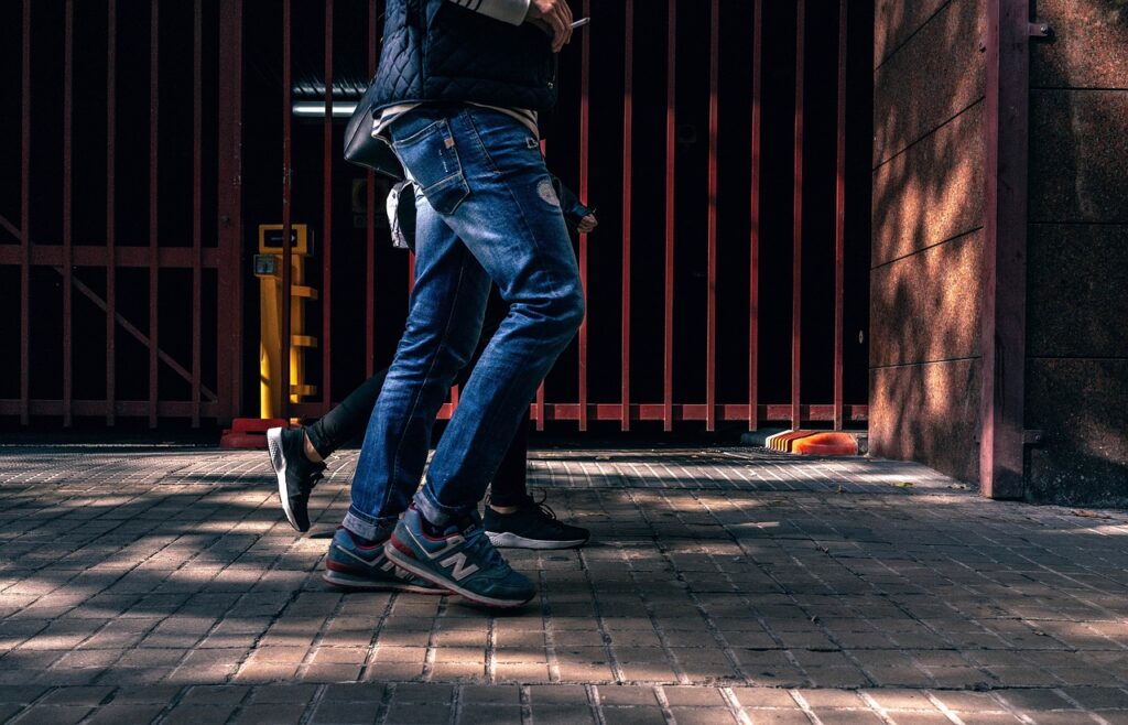 People walking down an urban street.