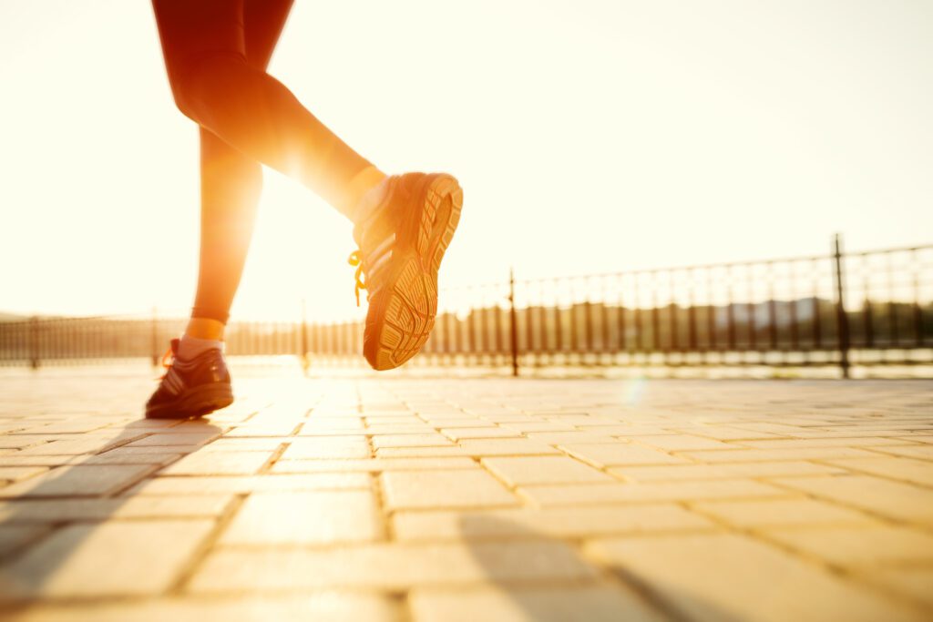 A person running at sunrise