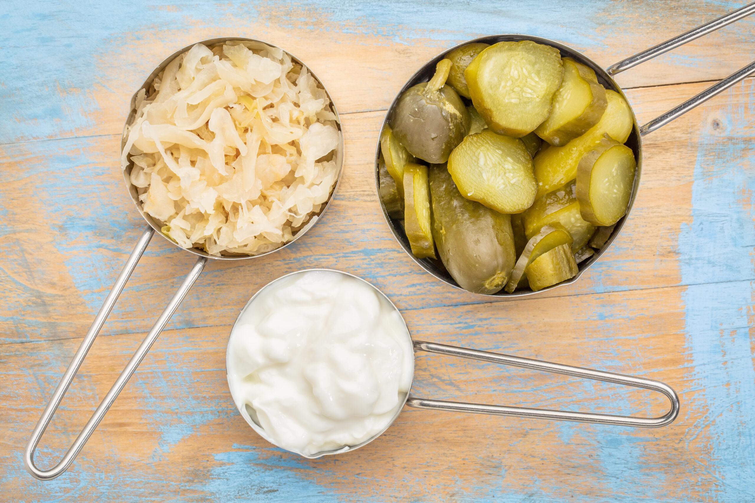 Sauerkraut, cucumber pickles and yogurt - popular probiotic fermented foods