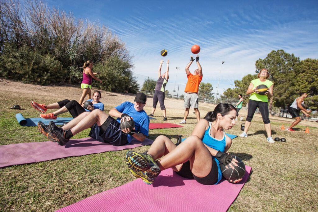 People doing an outdoor bootcamp as a form aerobic conditioning