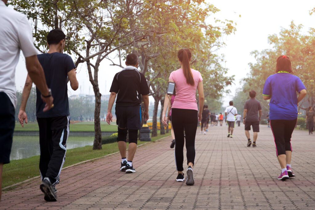 People walking as a form of exercise in a city.