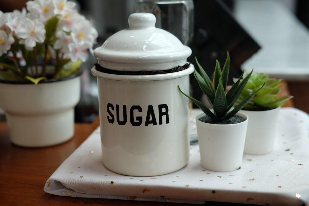 A pot of sugar on a table.