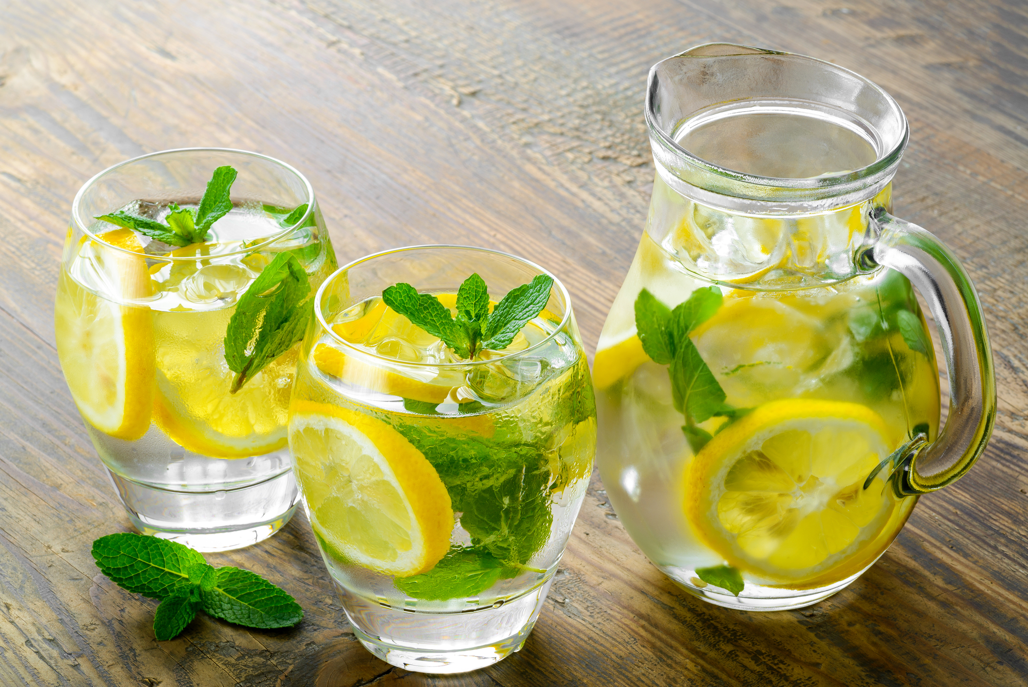 Two glasses and a jug of lemon water